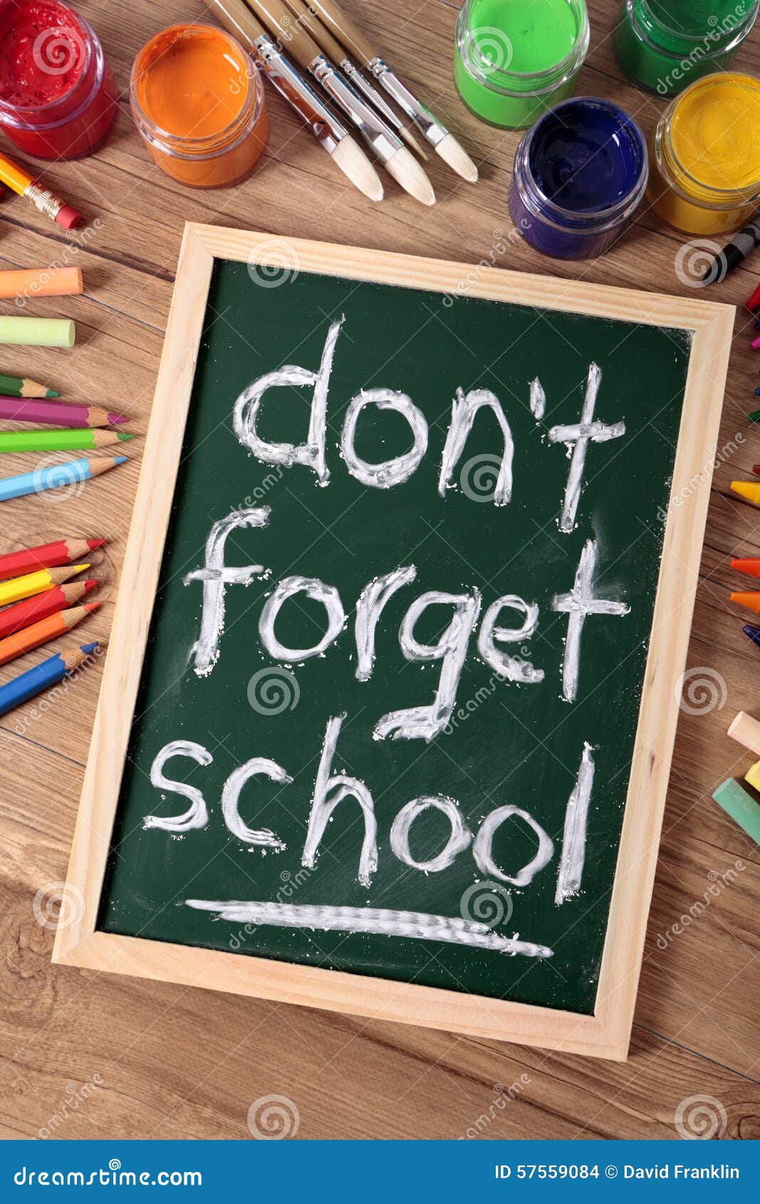 don t forget school back to school concept desk blackboard vertical words written small elementary various paints 57559084