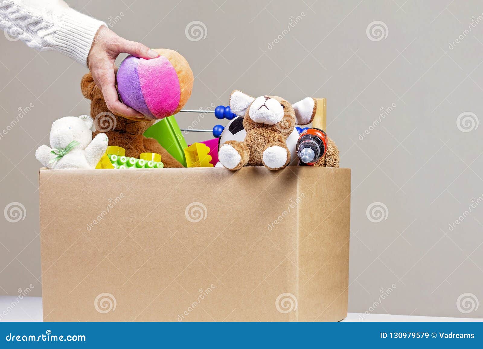 Download Donation Concept. Woman Collecting Donation Box With Clothes, Toys And Books Stock Image - Image ...