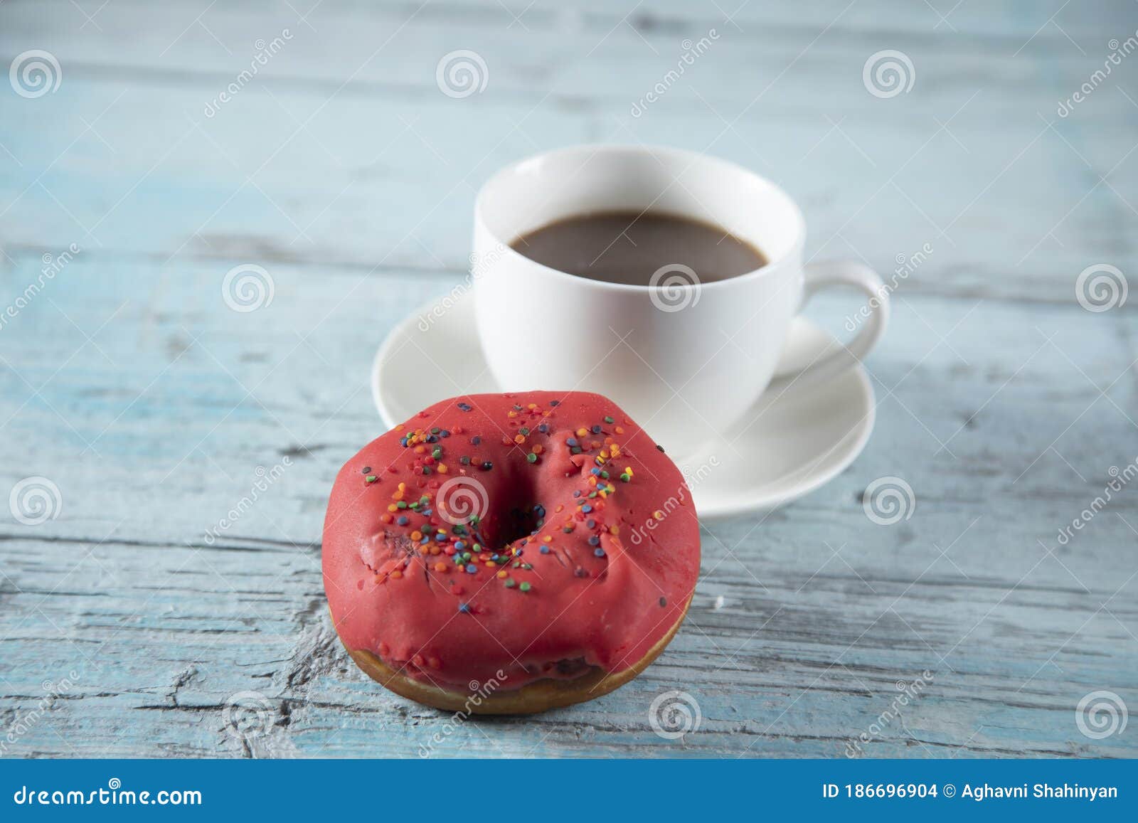 Donut and coffee on table stock photo. Image of black 186696904
