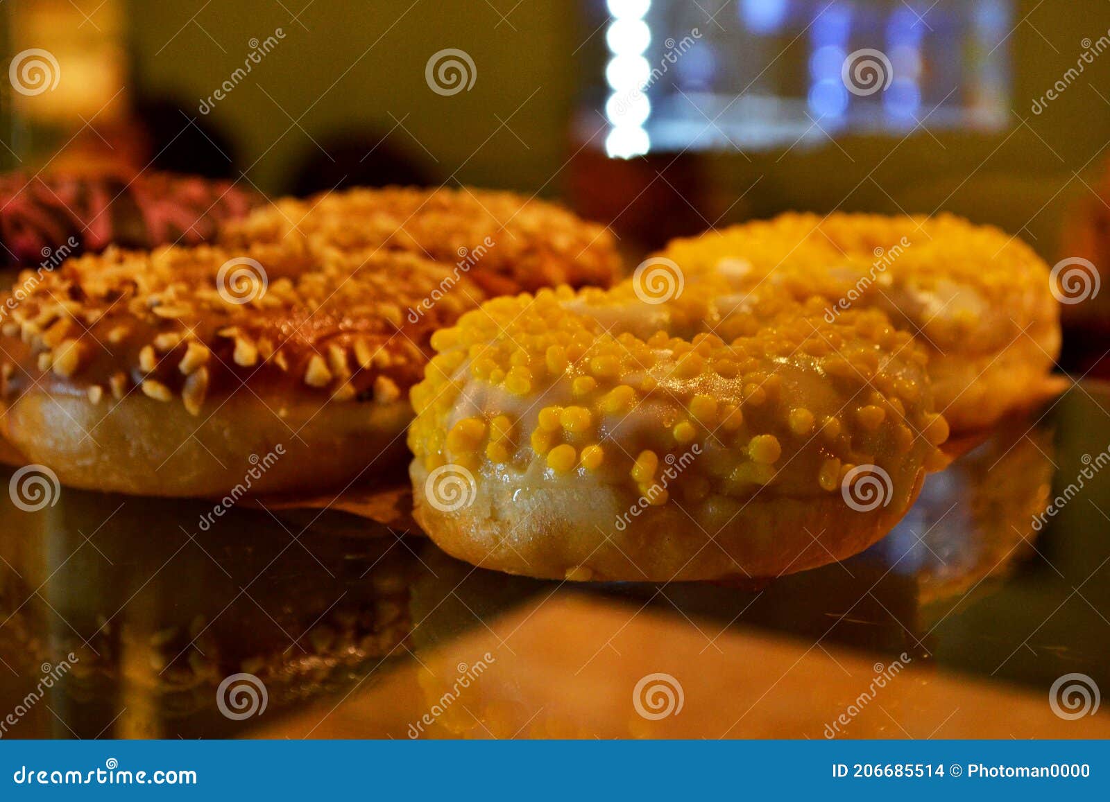 Donuts on a Glass Display Case Stock Photo Image of pink, delicious