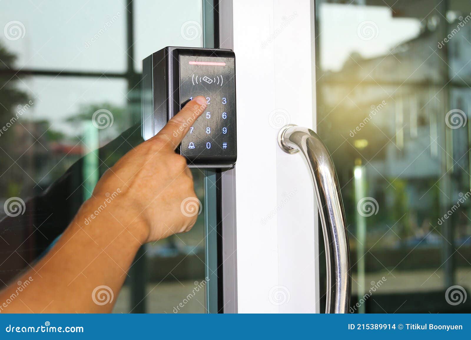 close-up hand inserting keycard to lock and unlock door - door access control keypad with keycard reader