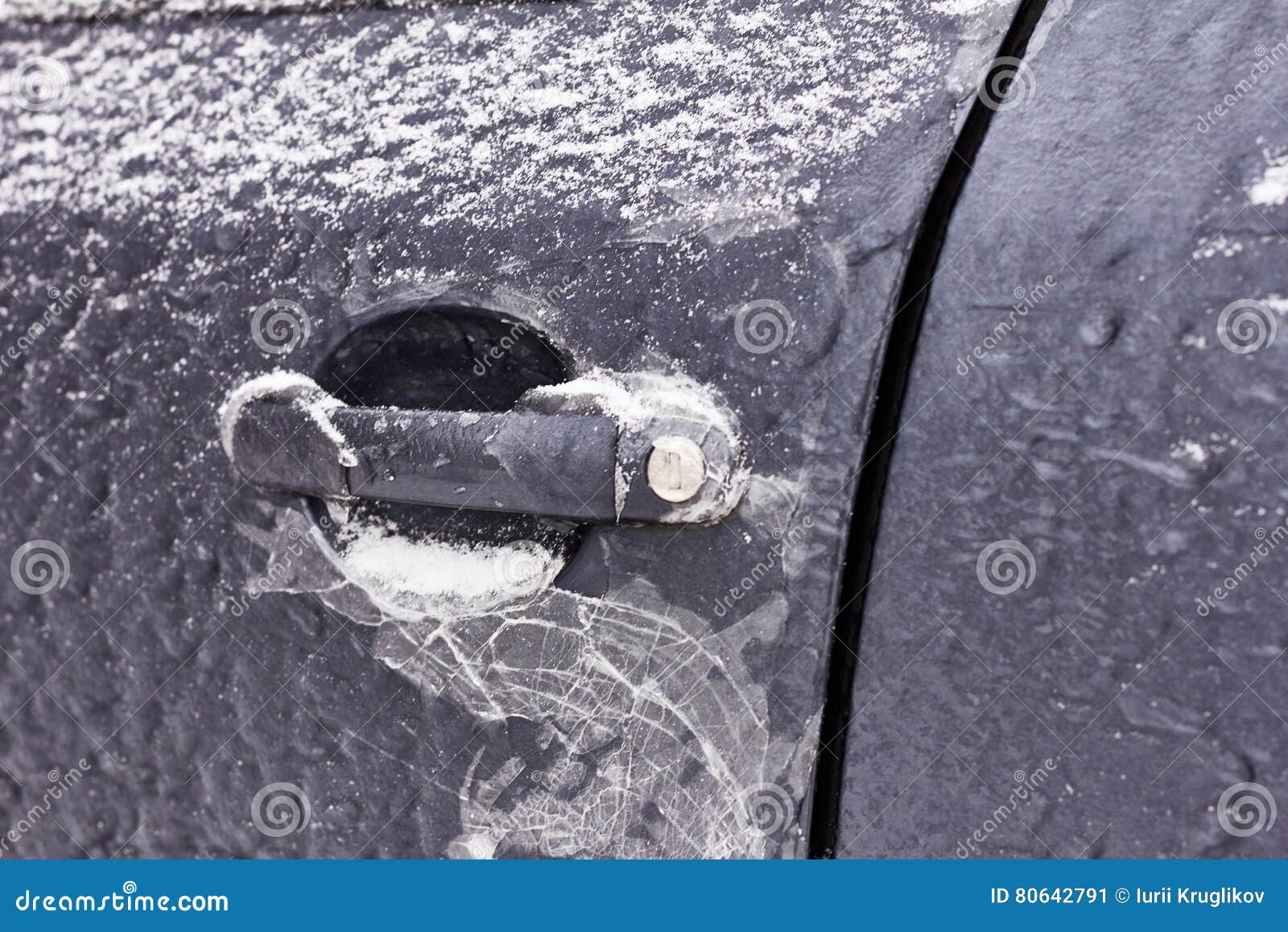 Door Knob Keyhole Of Car Covered With Snow And Ice After A