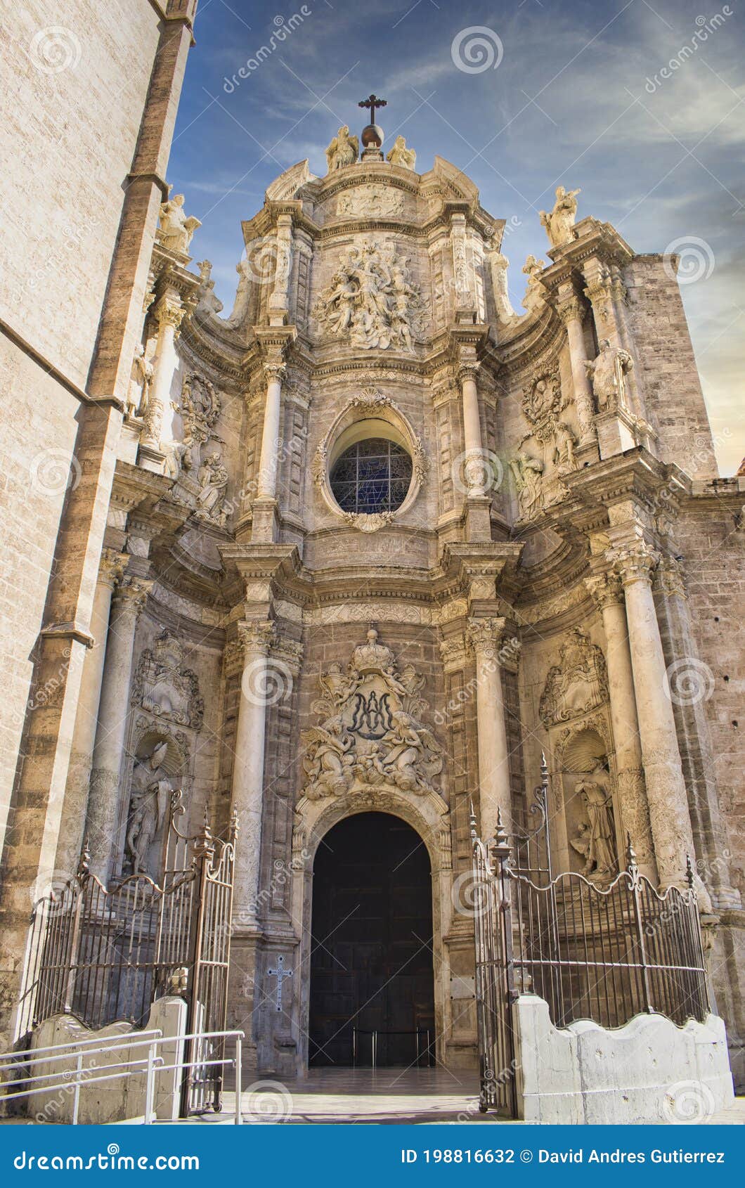 door of los hierros and baroque facade of the cathedral of valencia