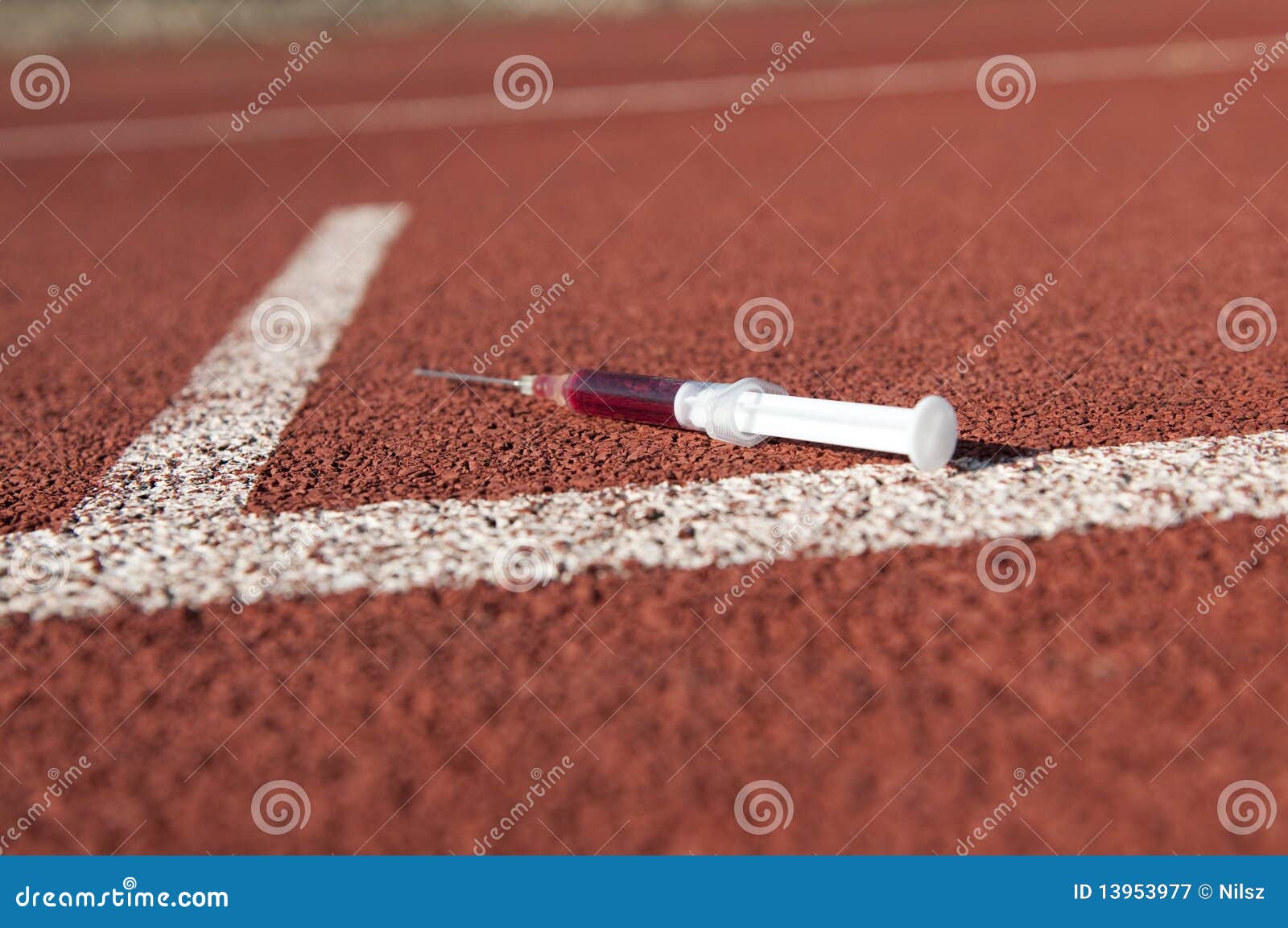 doping syringe on athletics sports area
