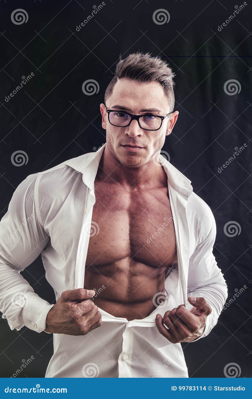 dorky man with glasses and muscle chest under shirt