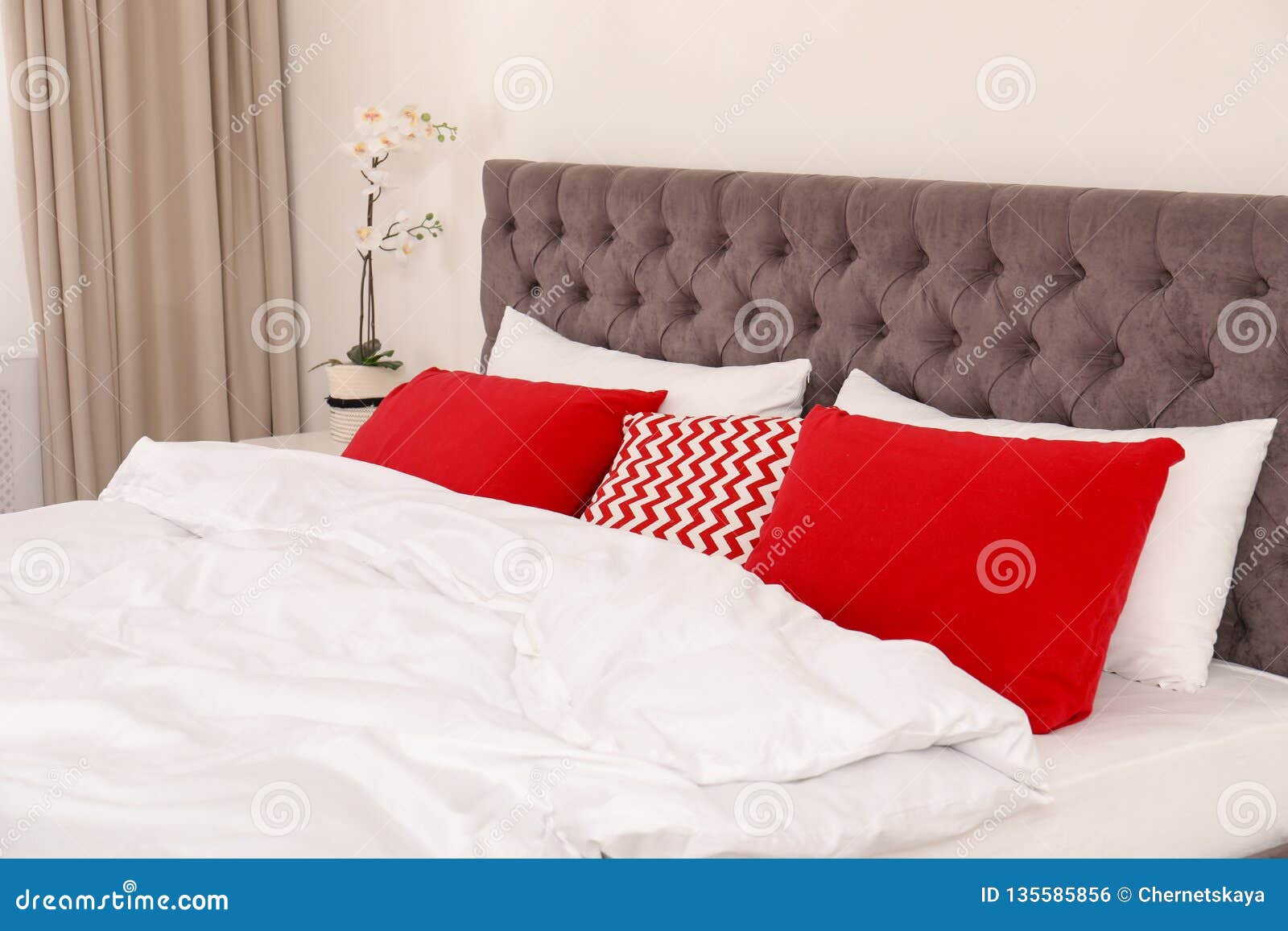 Double Bed with Bright Pillows in Room. Stock Photo Image of bright