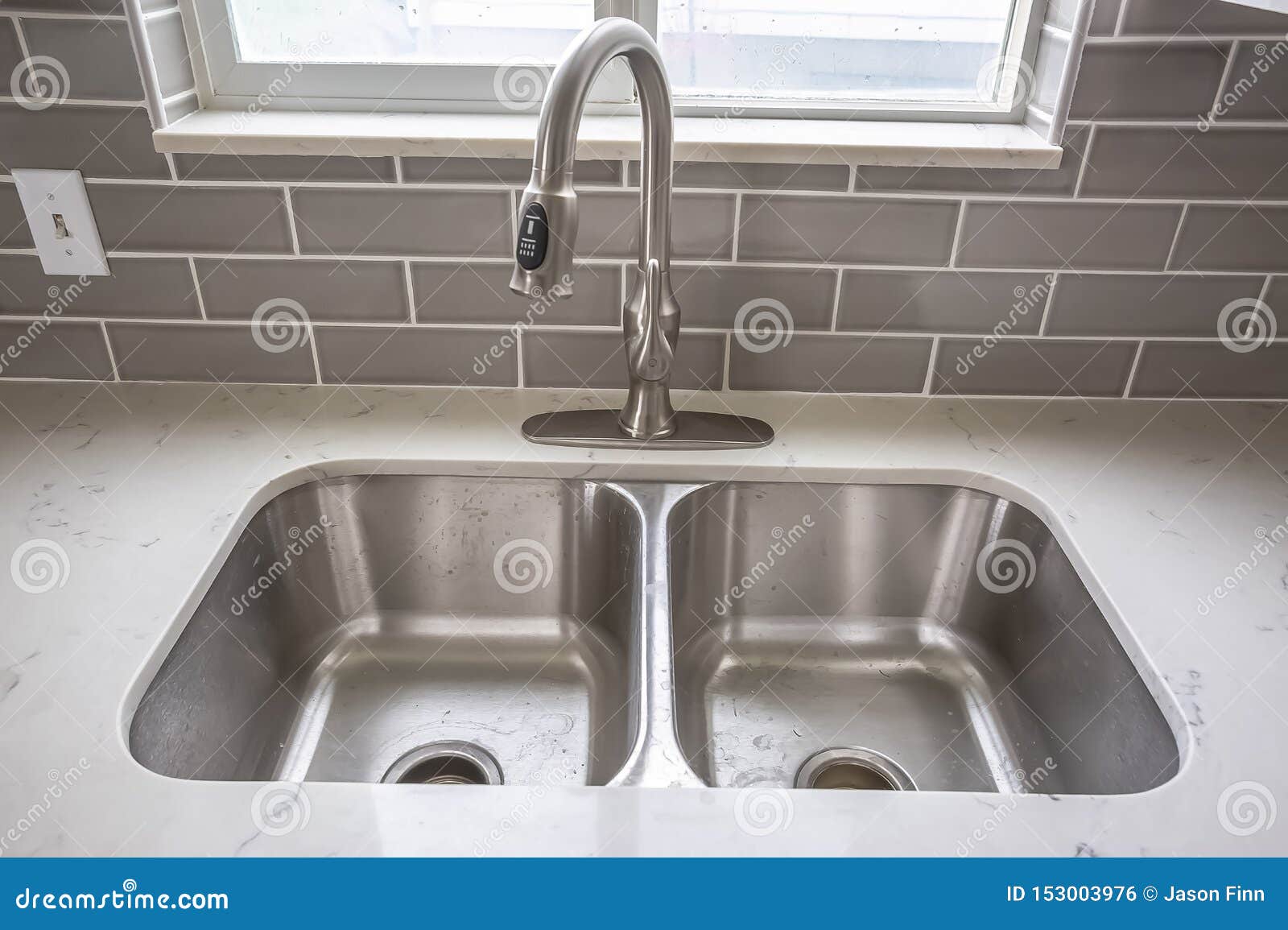 Double Bowl Stainless Steel Sink Undermounted on the White Kitchen ...