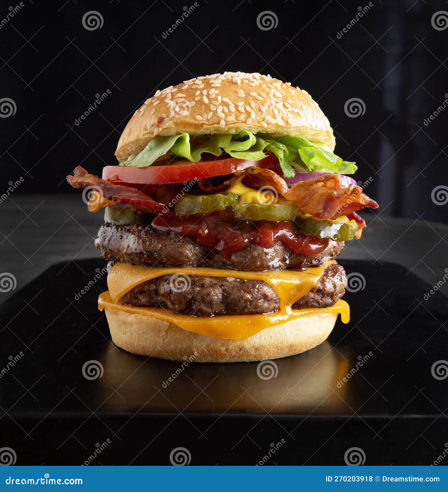 double cheeseburger on black background
