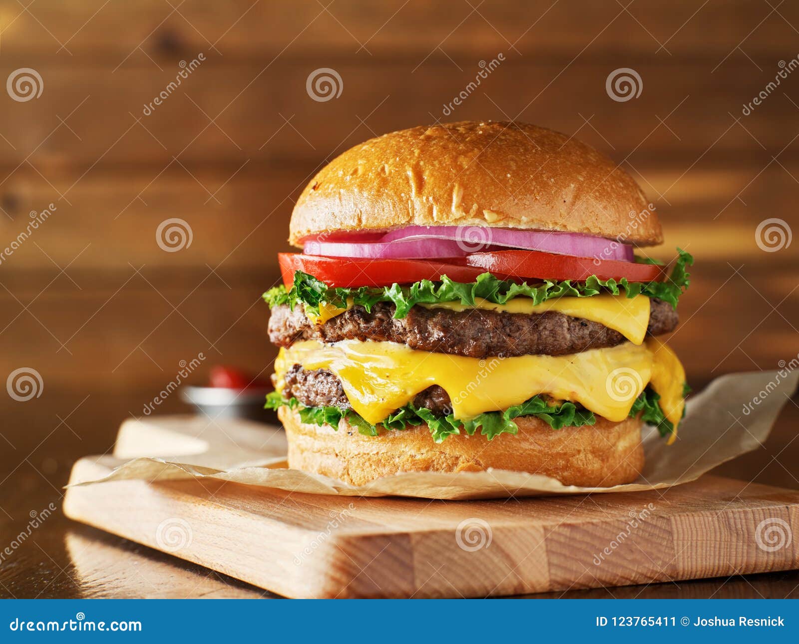 double cheeseburger with lettuce, tomato, onion, and melted american cheese