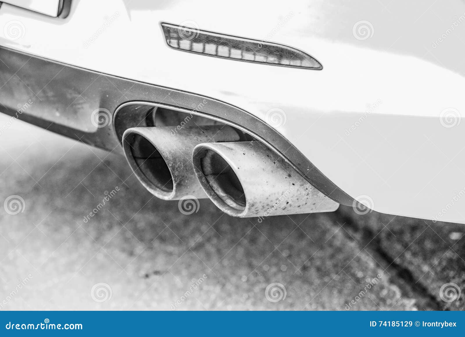 Double Exhaust Pipes of a Modern Sports Car, Black and White Stock Image -  Image of engine, gasoline: 74185129