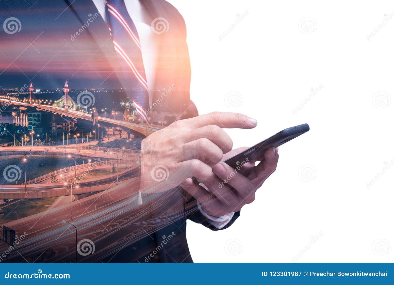 the double exposure image of the businessman using a smartphone during sunrise overlay with cityscape image. the concept of modern