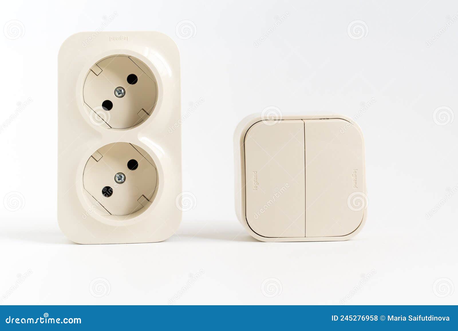 double socket and two-key light switch on white background.