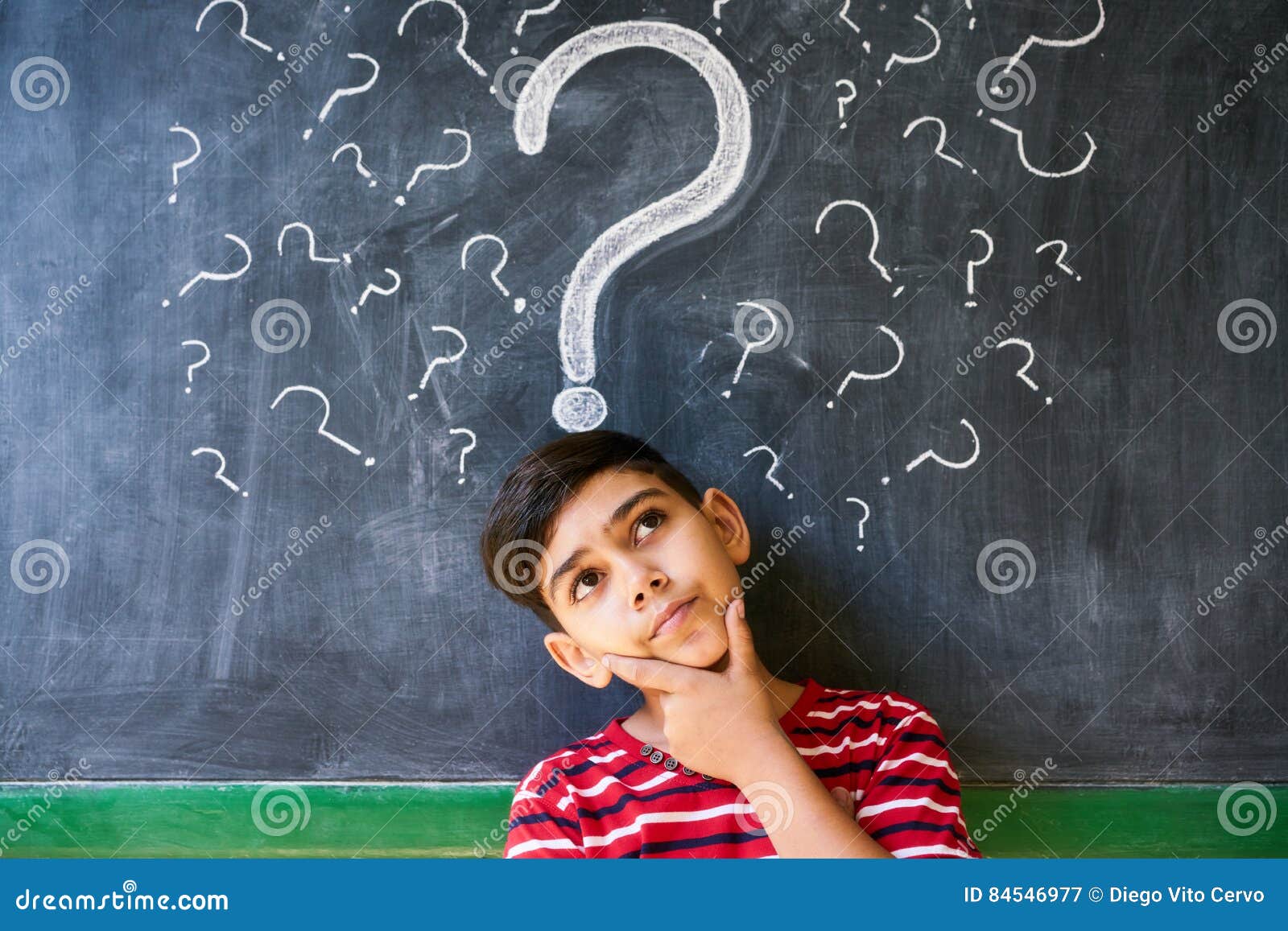 doubts and question marks with child thinking at school