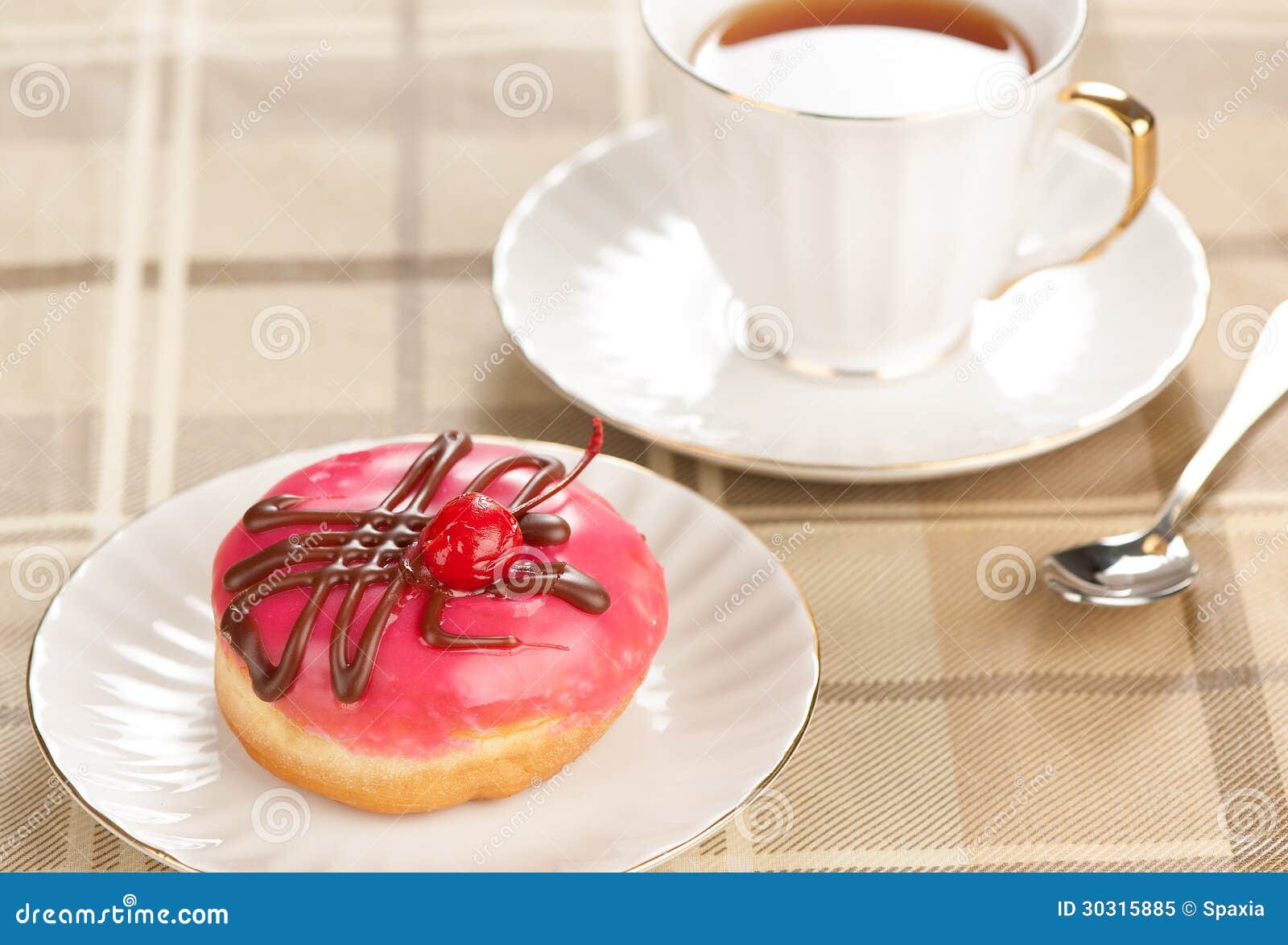 Doughnut and cup of tea stock image. Image of ring, cherry 30315885