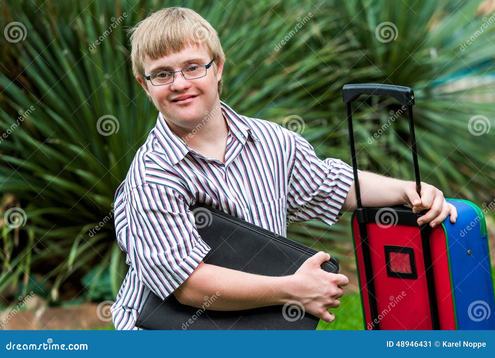 down syndrome student with file and trolley.