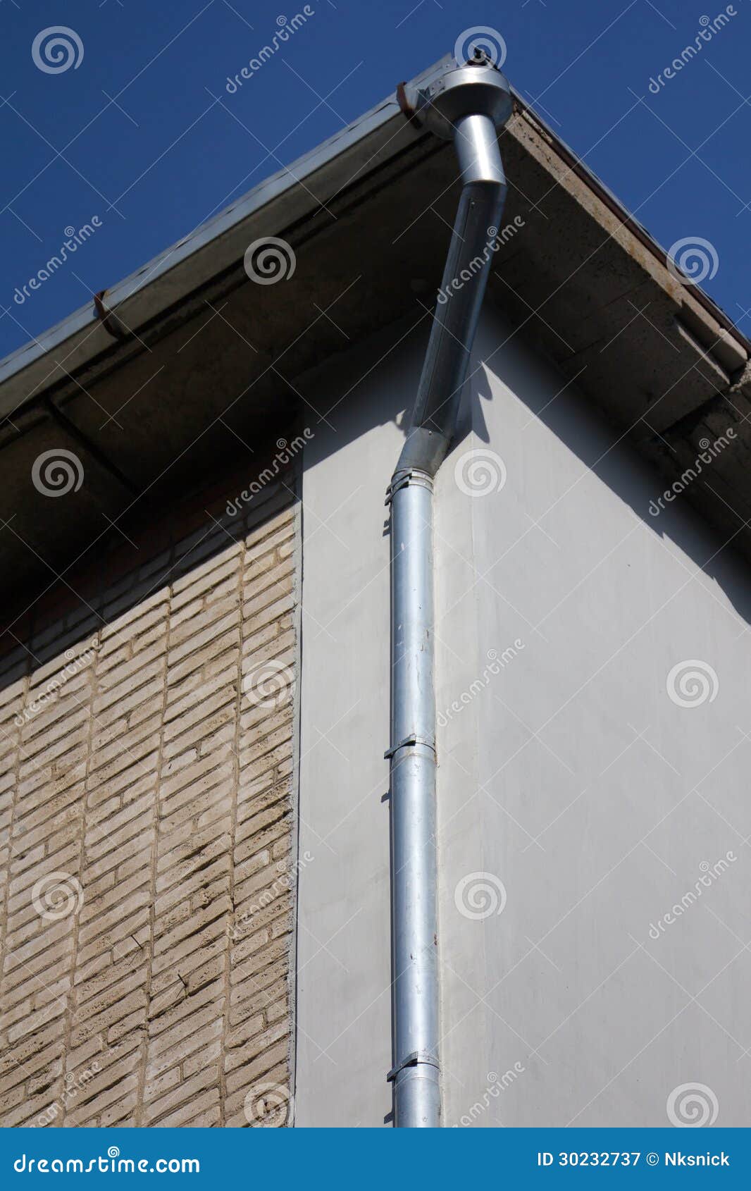 Downspout on a brick wall stock image. Image of tube 30232737