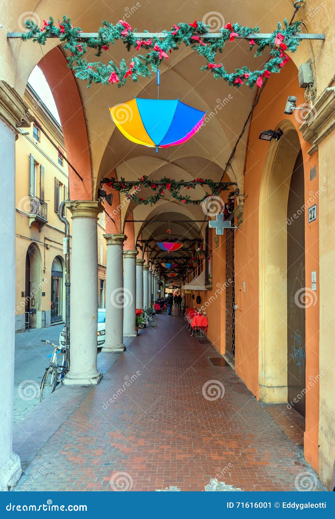 Downtown porch in Bologna. Bologna, Italy - December 27, 2015: day view of Bologna s passage way. In total, there are about 38 kilometres of arcades in the city s historical centre In Bologna, Italy.