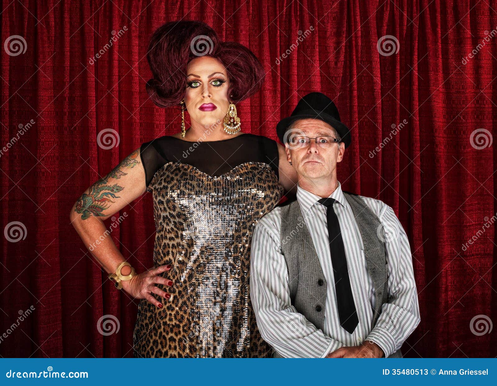 Drag Queen and Retro Man. Odd couple drag queen with men at curtain