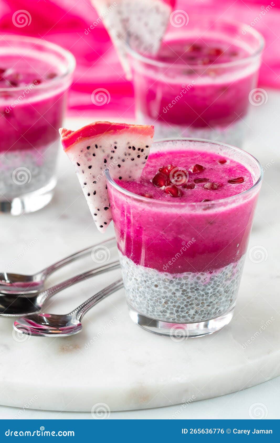 Dragon Fruit Chia Pudding Parfaits Topped with Pomegranate Arils. Stock