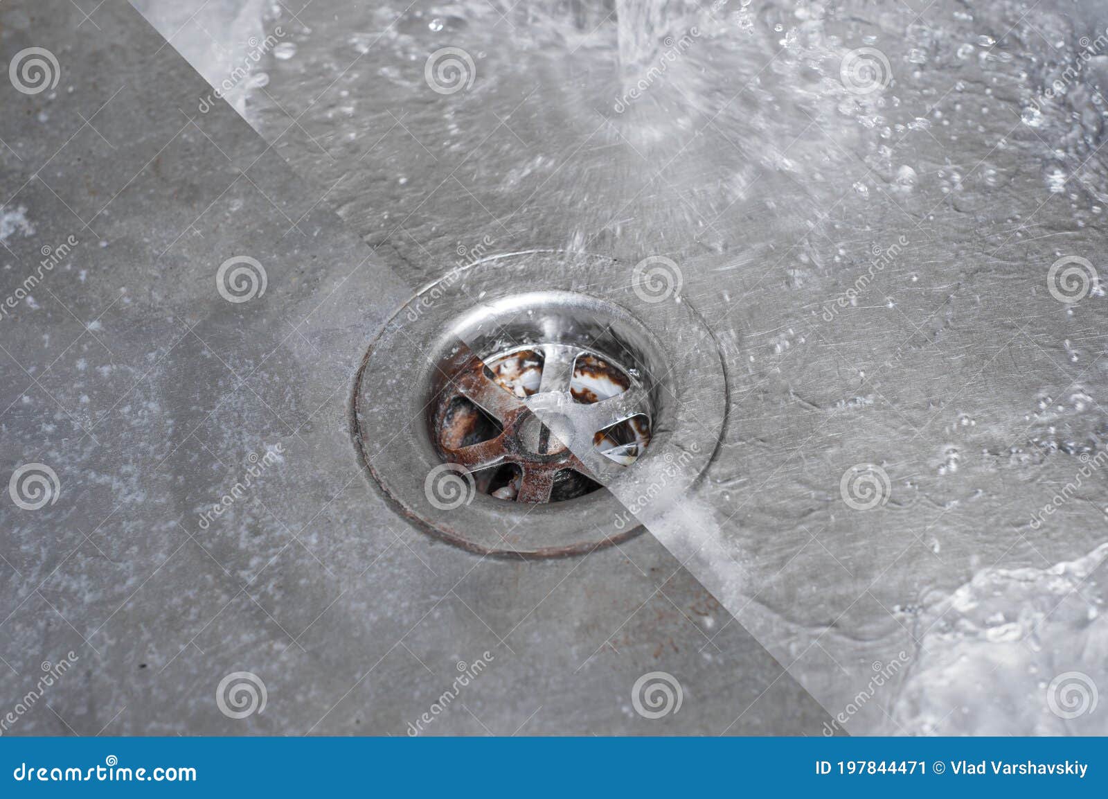The Drain Hole of the Kitchen Sink is Half Full of Water Stock Image