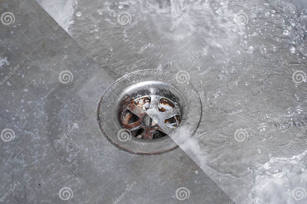 The Drain Hole of the Kitchen Sink is Half Full of Water Stock Image