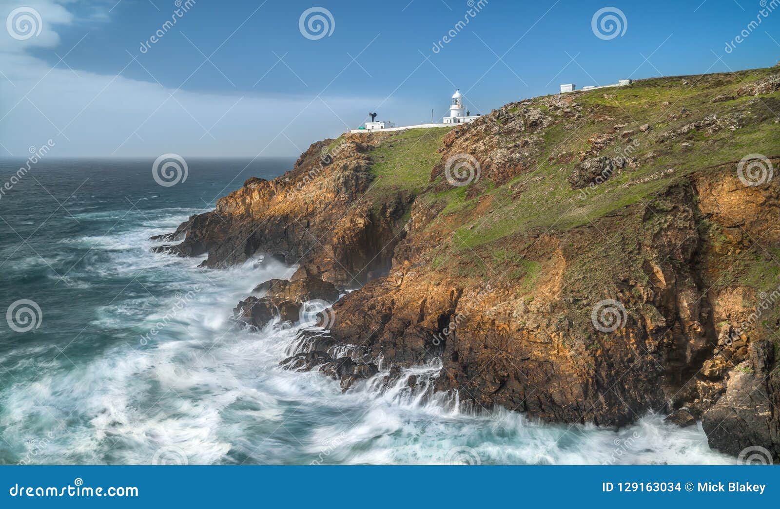 dramatic cliffs and wavess, pendeen point lighthouse, cornwall