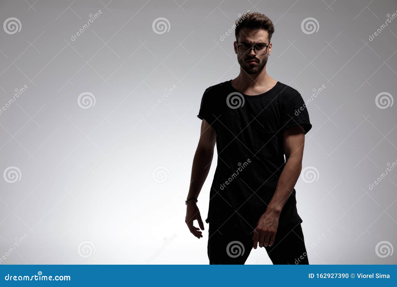 Dramatic Cool Guy Wearing Glasses and Standing in Fashion Pose Stock ...