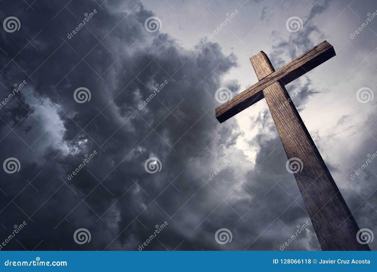 dramatic cloudscape and wooden cross