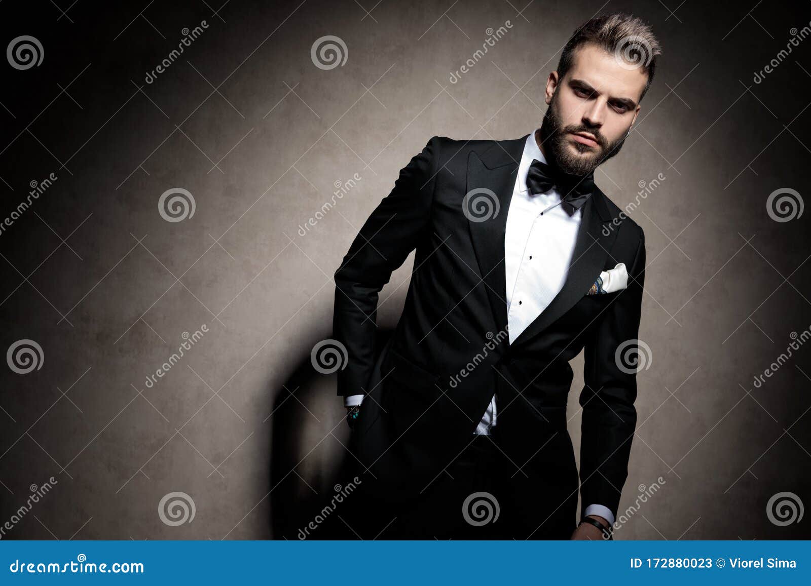 Dramatic Elegant Young Model In Tuxedo Posing In A Fashion Light Stock ...