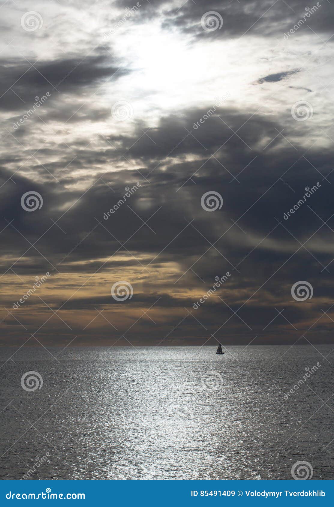 Dramatic Evening Seascape with Sailing Boat on Dark Sea Stock Image ...