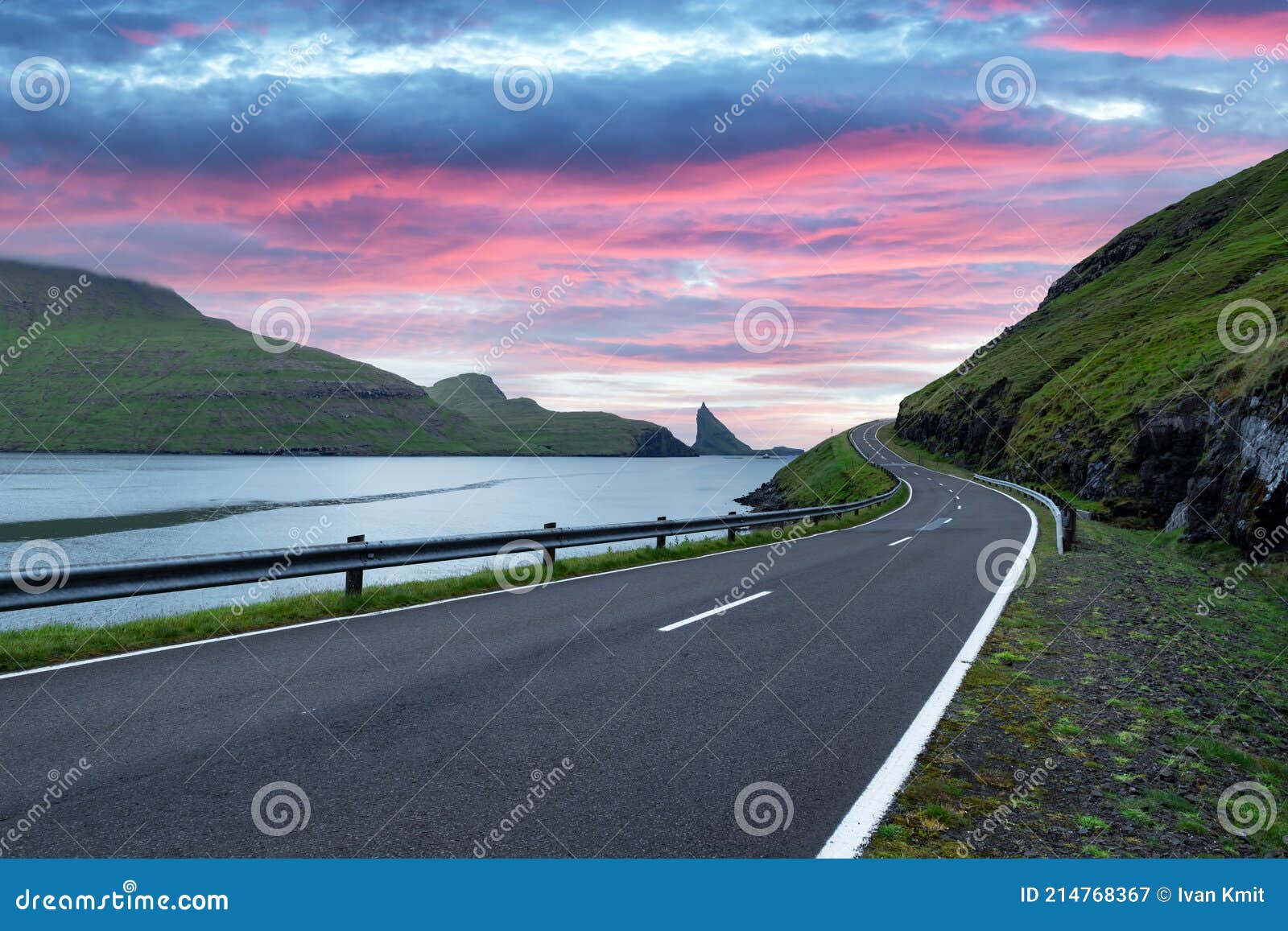 dramatic evening view of road and tindholmur cliffs