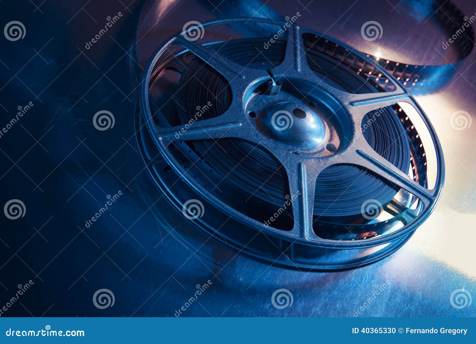 dramatic lit image of a movie reel