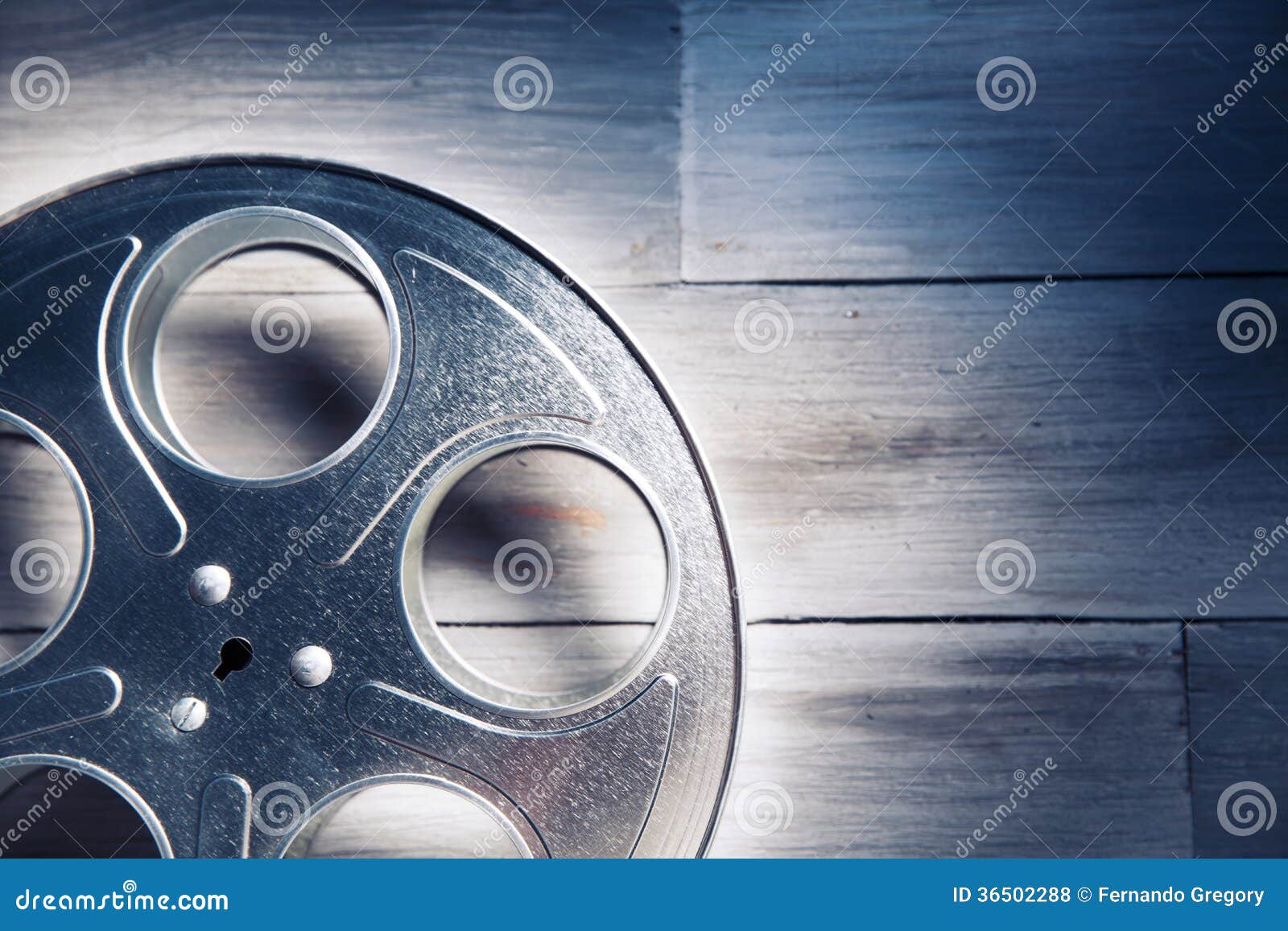 dramatic lit image of a movie reel