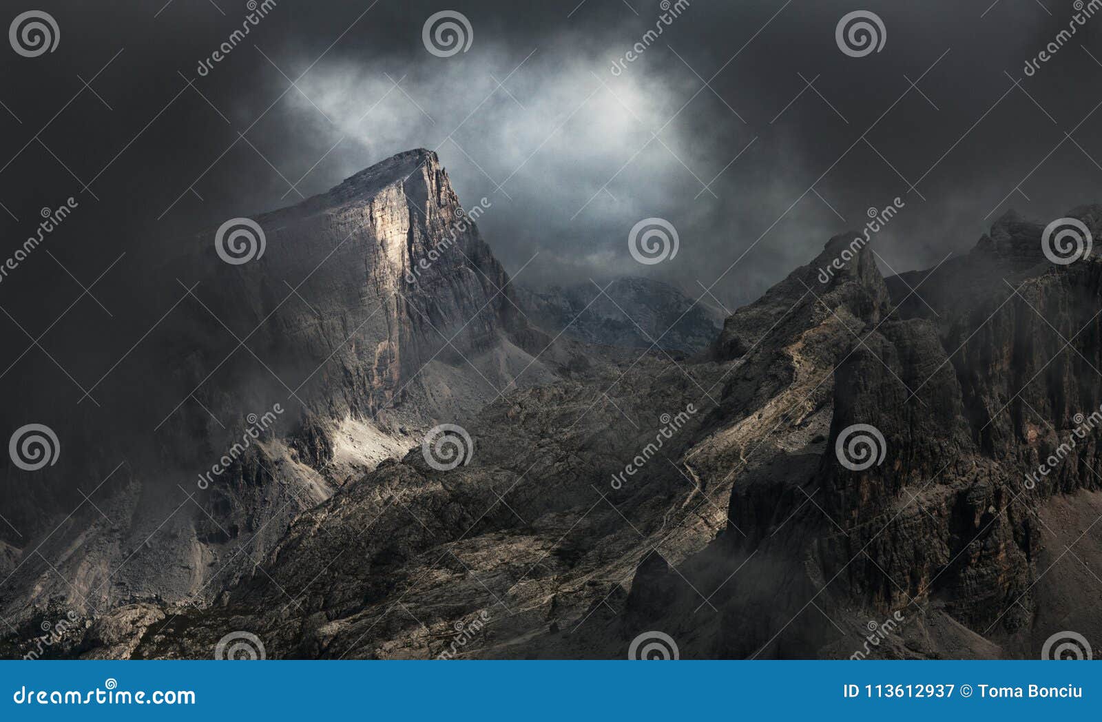 dramatic mountain landscape in fog and mist - dolomite mountains