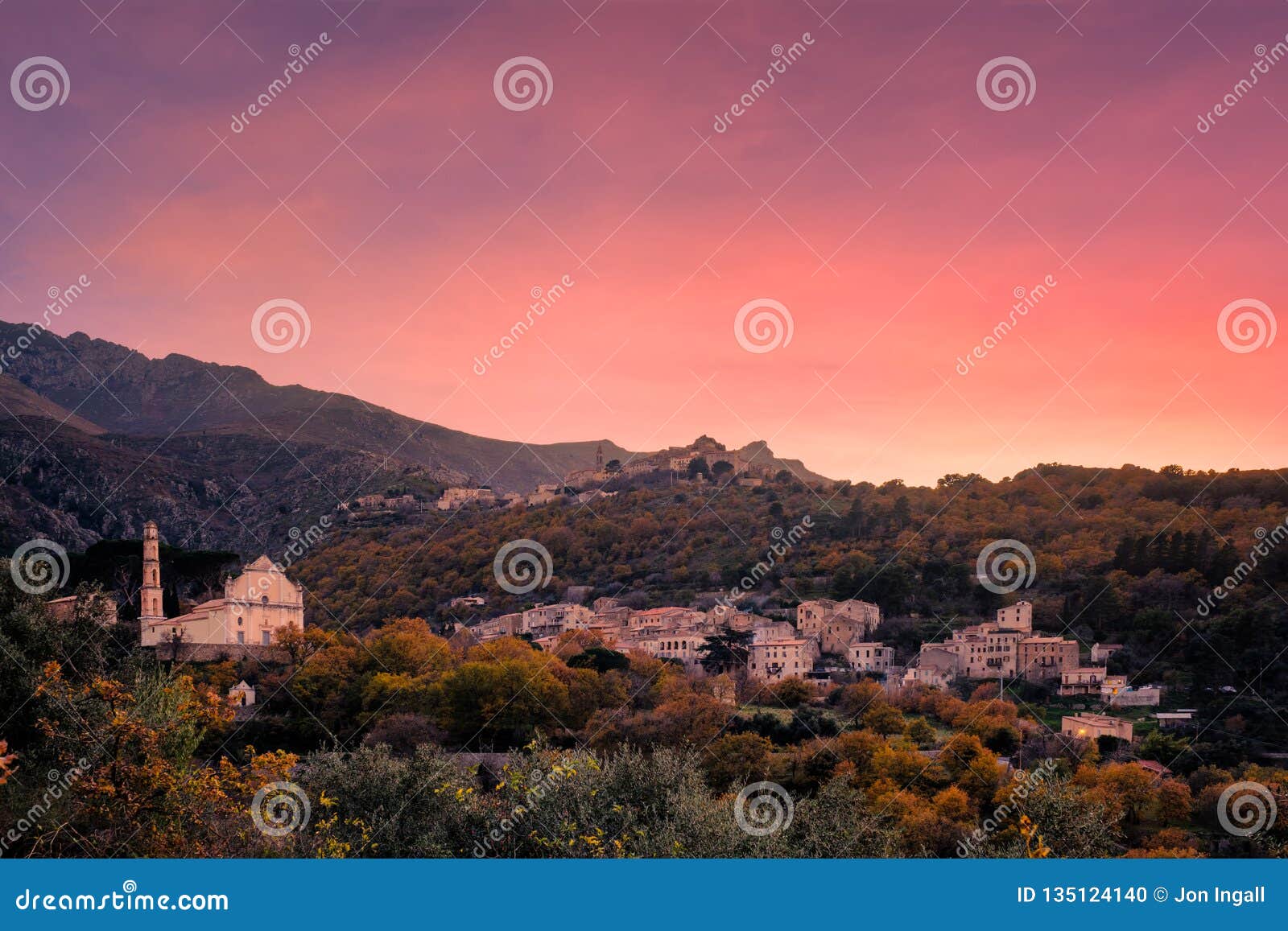 sunset over mountain villages in corsica
