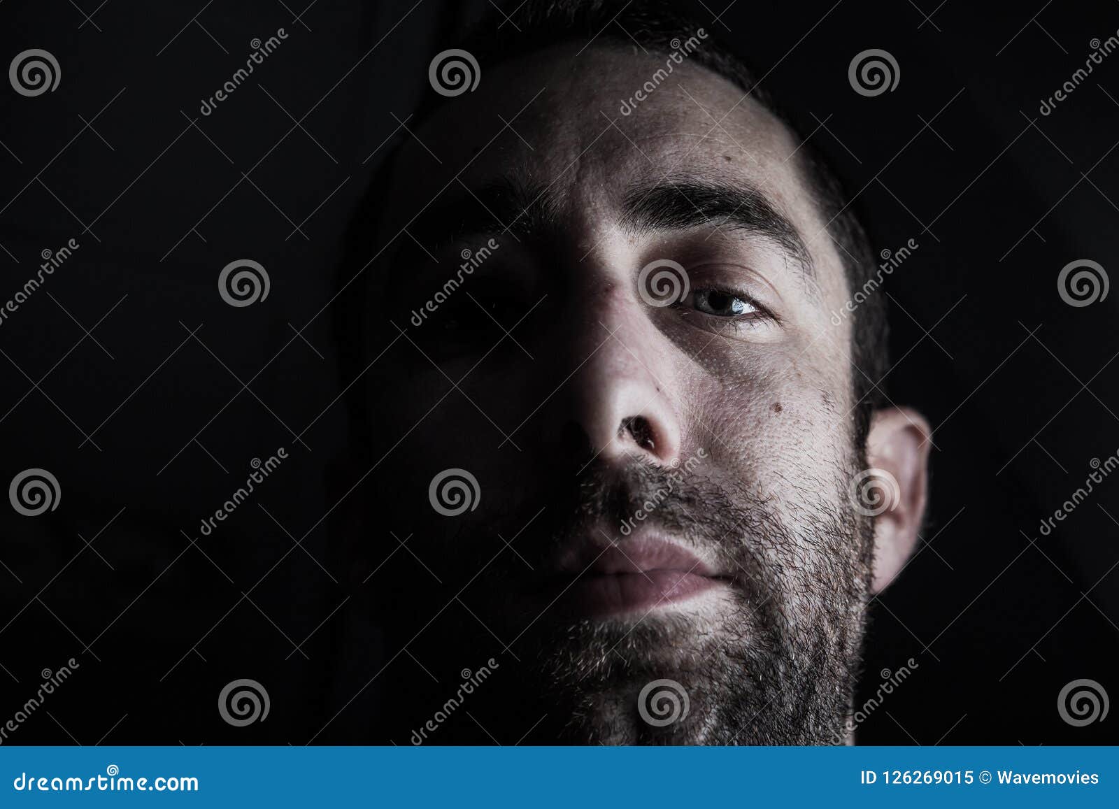 Dramatic Portrait of a Young Man Half Expressionless Face in Dee Stock ...