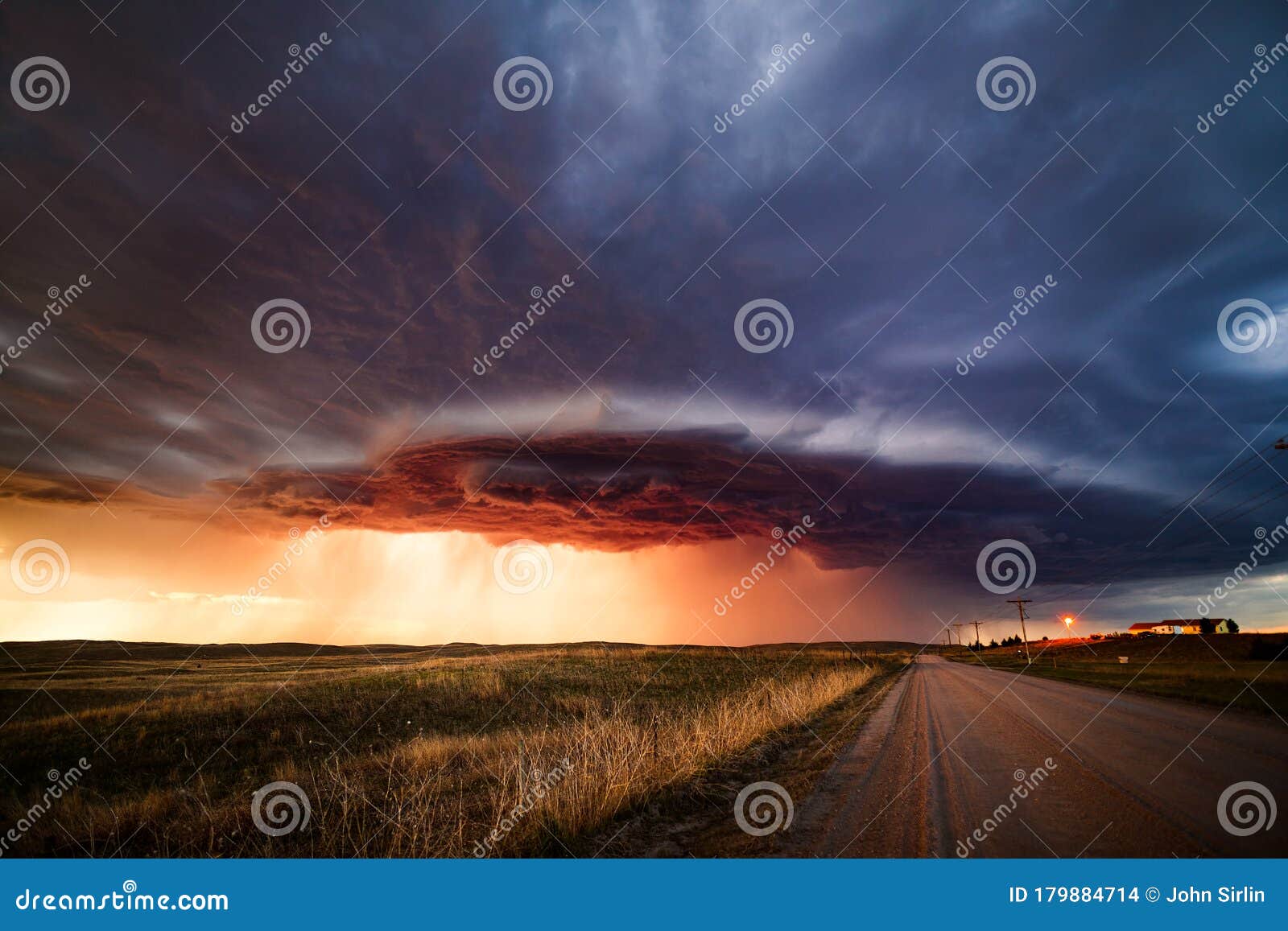 dramatic sky with ominous storm clouds at sunset.