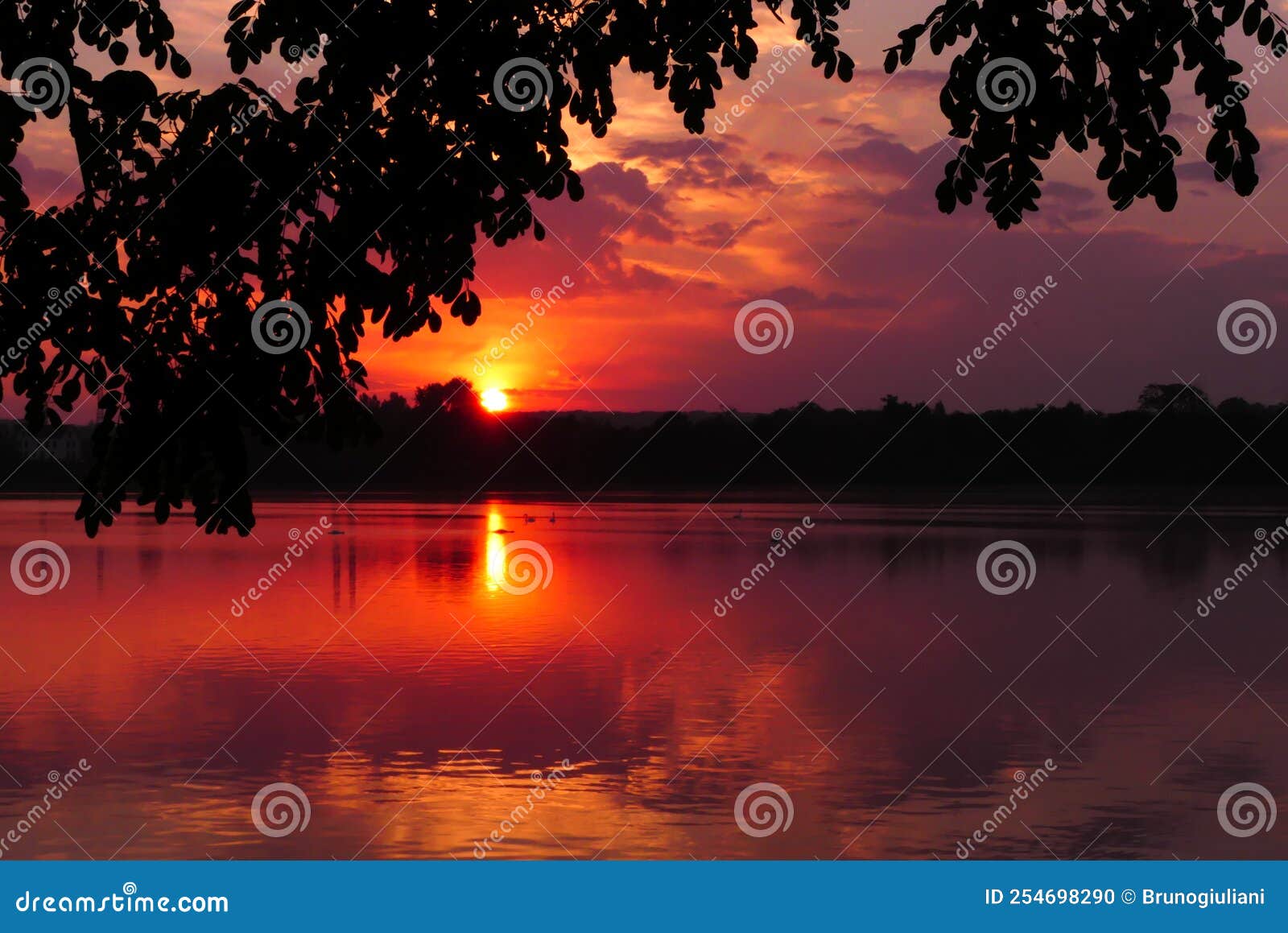 Dramatic Sky At Sunset Over The Water Stock Photo Image Of Scene