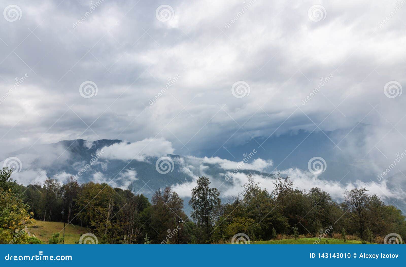 dramatic sky with thunderclouds and fog over the valley of the river mzymta, krasnodar region, russia