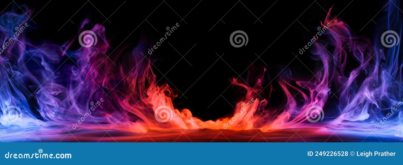 dramatic smoke and fog in contrasting vivid red, blue, and purple colors. vivid and intense abstract background or wallpaper