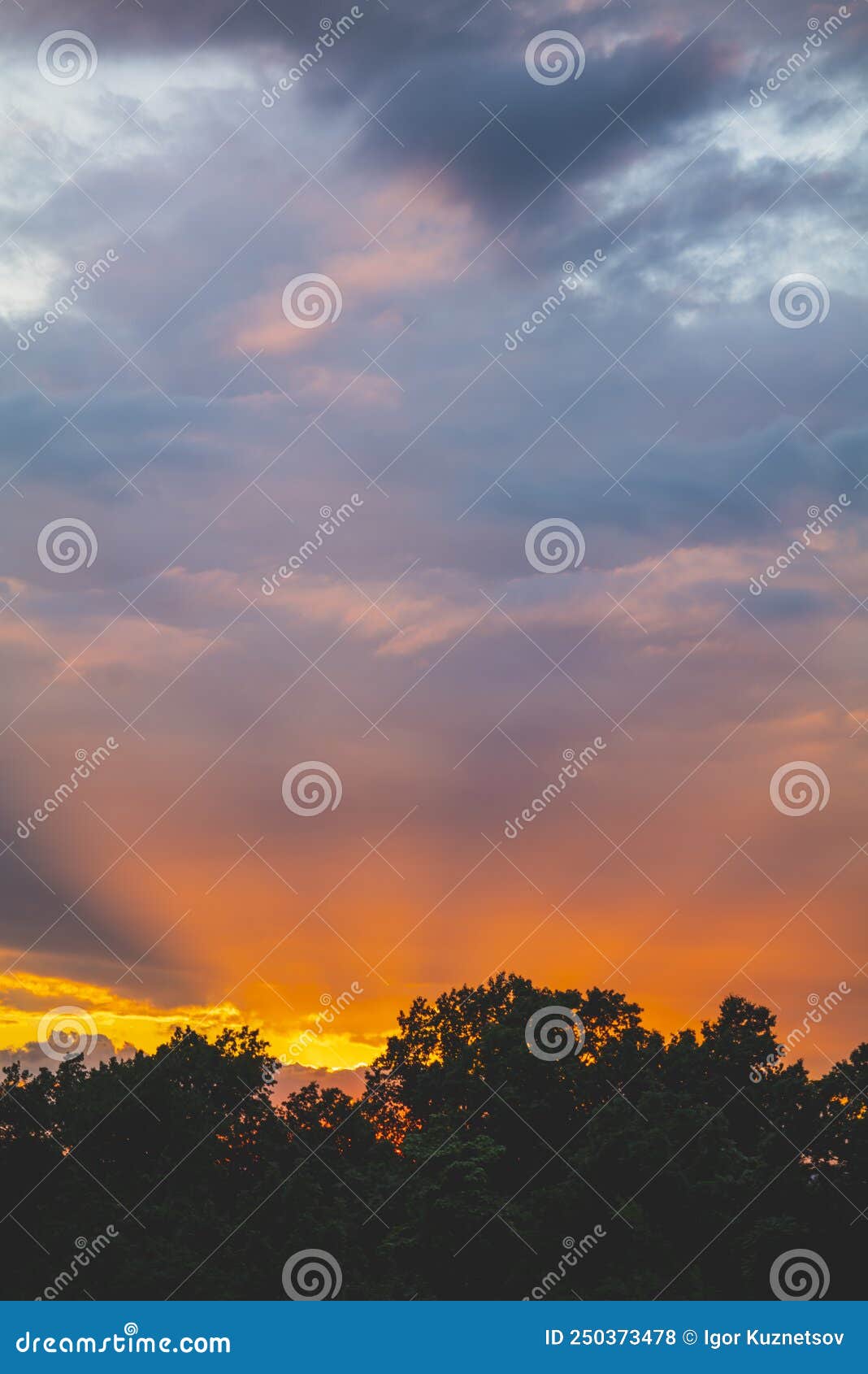 dramatic sunbeams behind the residential building with reflections in a windows, background photo