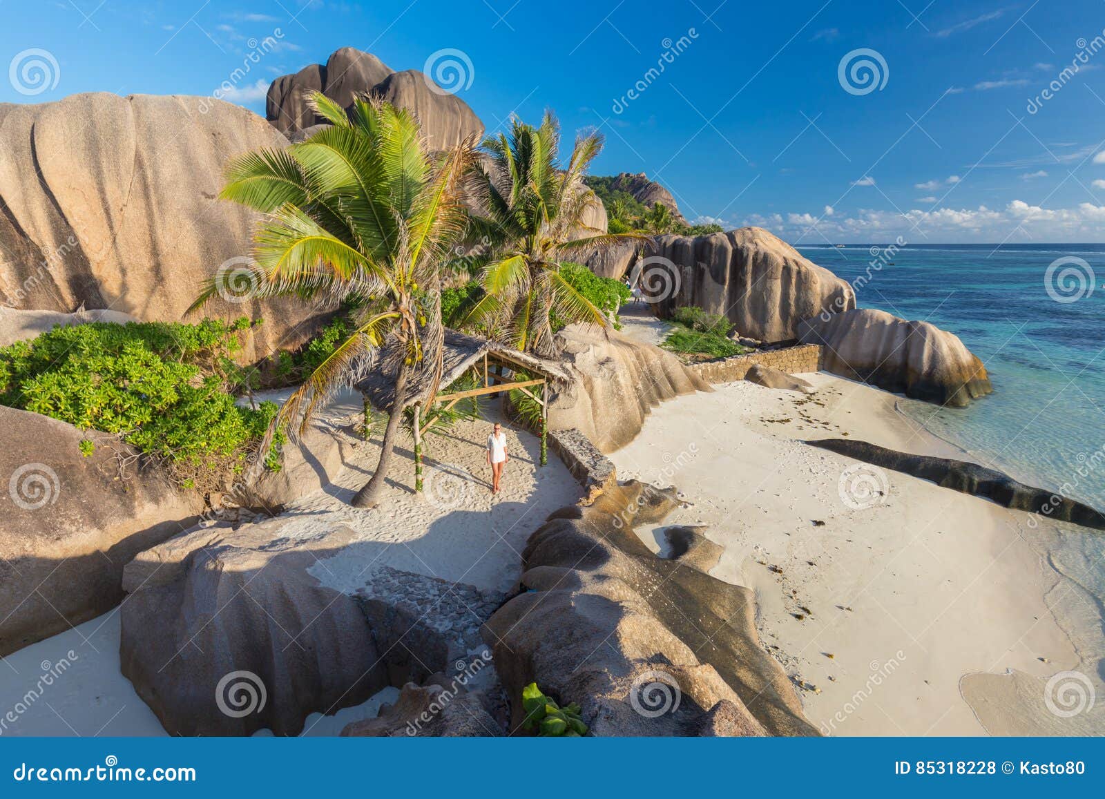 dramatic sunset at anse source d`argent beach, la digue island, seychelles
