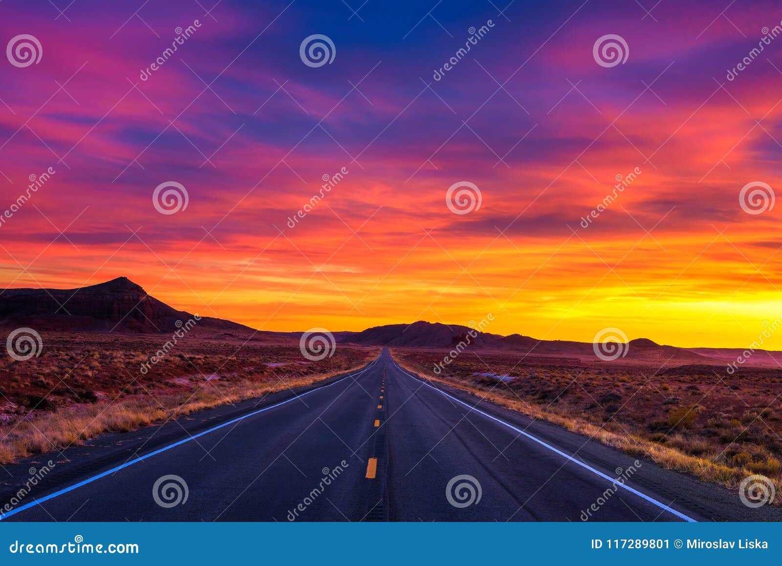 dramatic sunset over an empty road in utah