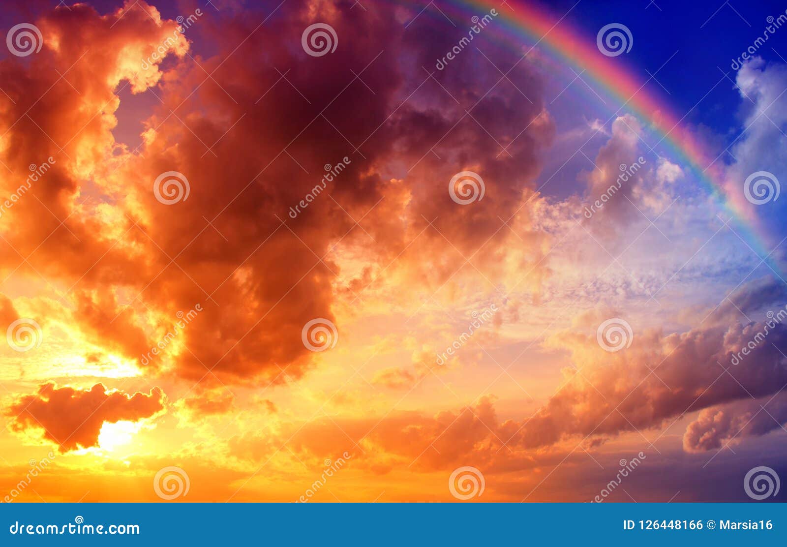 dramatic sunset sky with rainbow