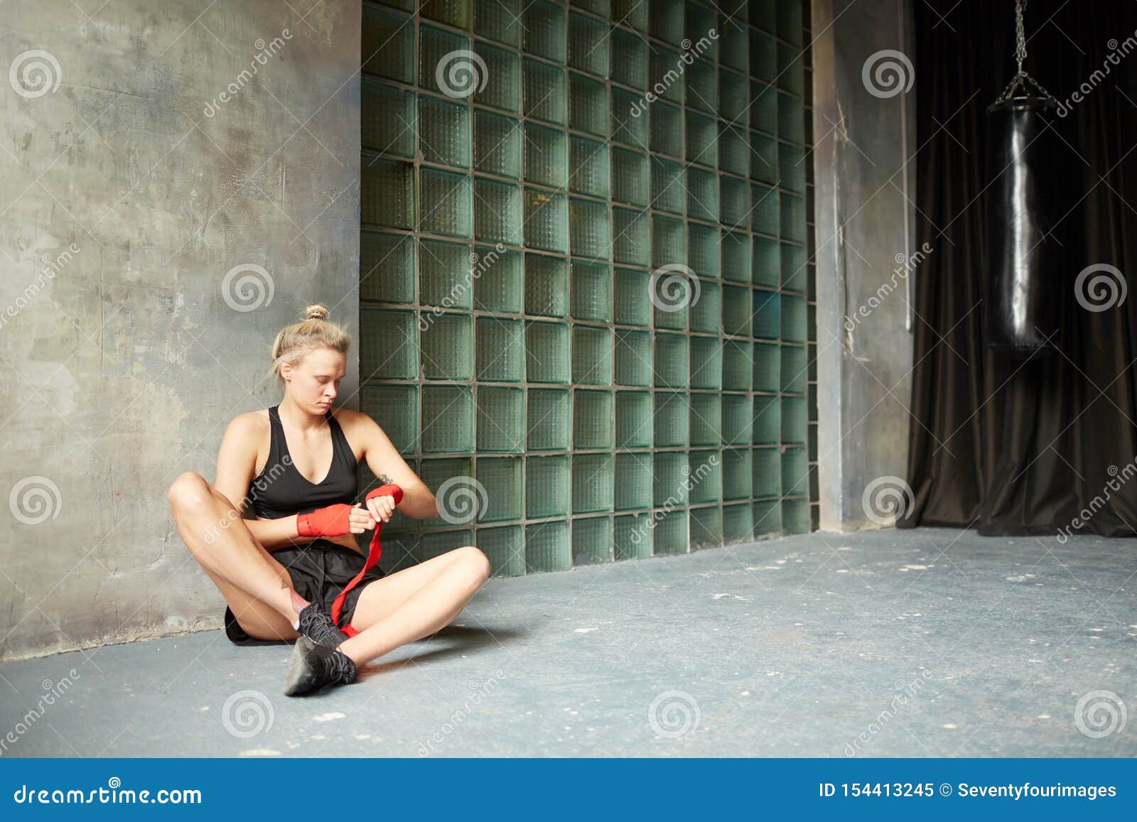 Tough Woman Wrapping Hands stock image. Image of fighter - 154413245