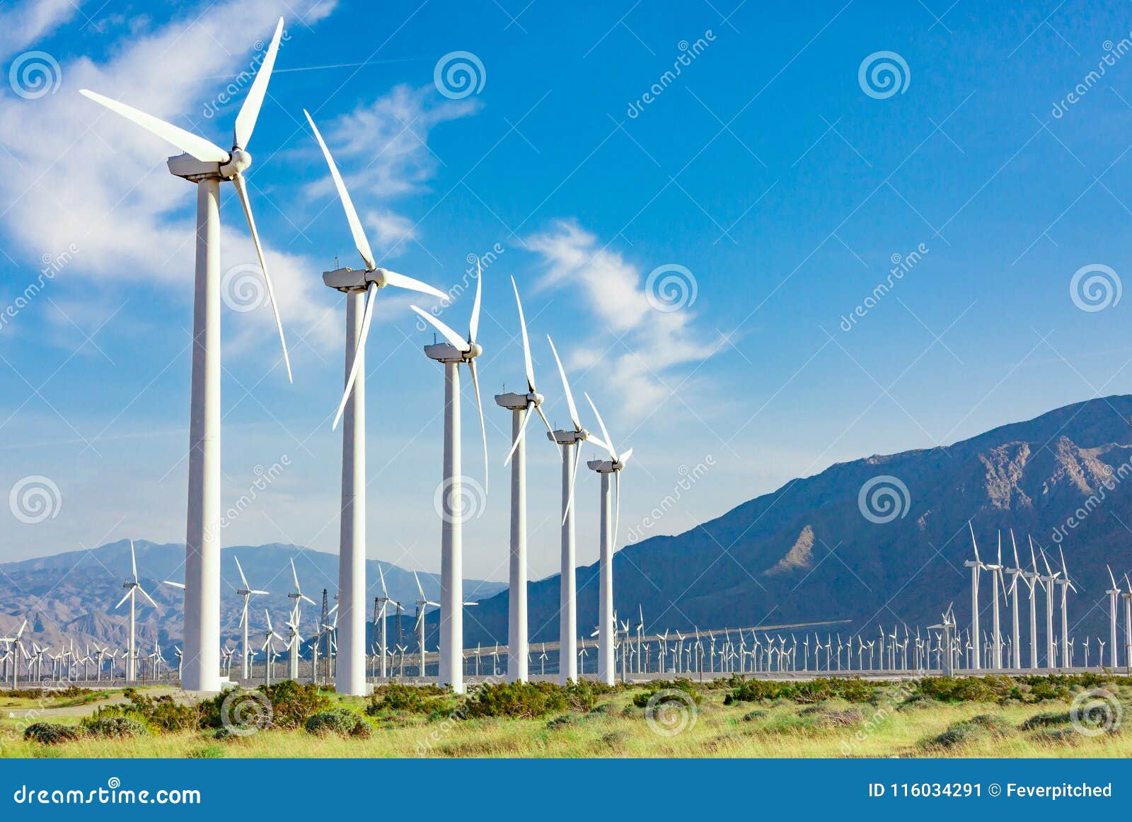 dramatic wind turbine farm in the deserts of california.