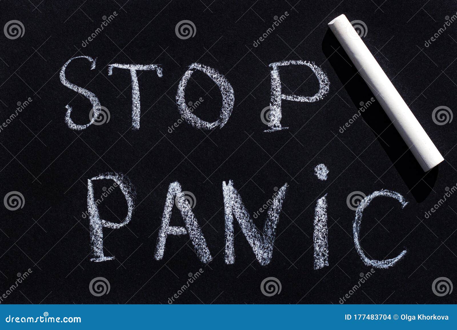 Drawing with Chalk on a Black Blackboard with Text Stop Panic Stock