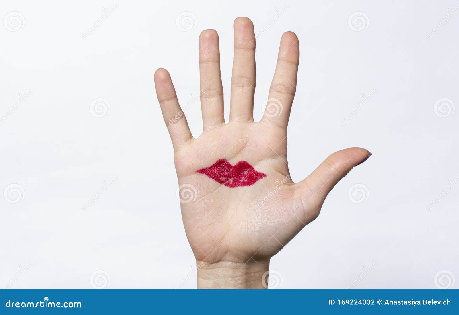 Drawn Red Lips on Female Palm Hand. Isolated Stock Photo Image of