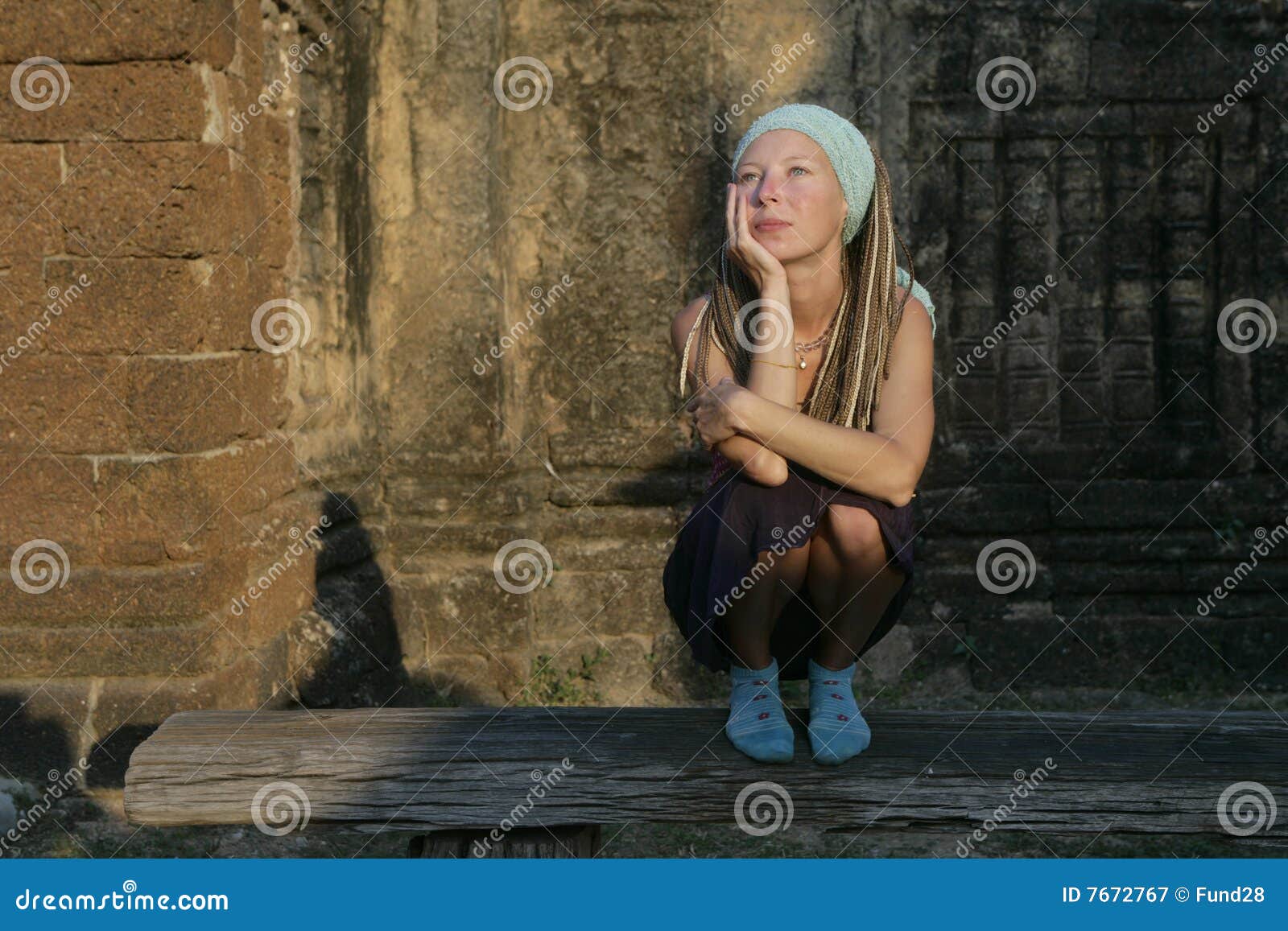 Dreaming girl on the bench stock image. Image of wall 7672767
