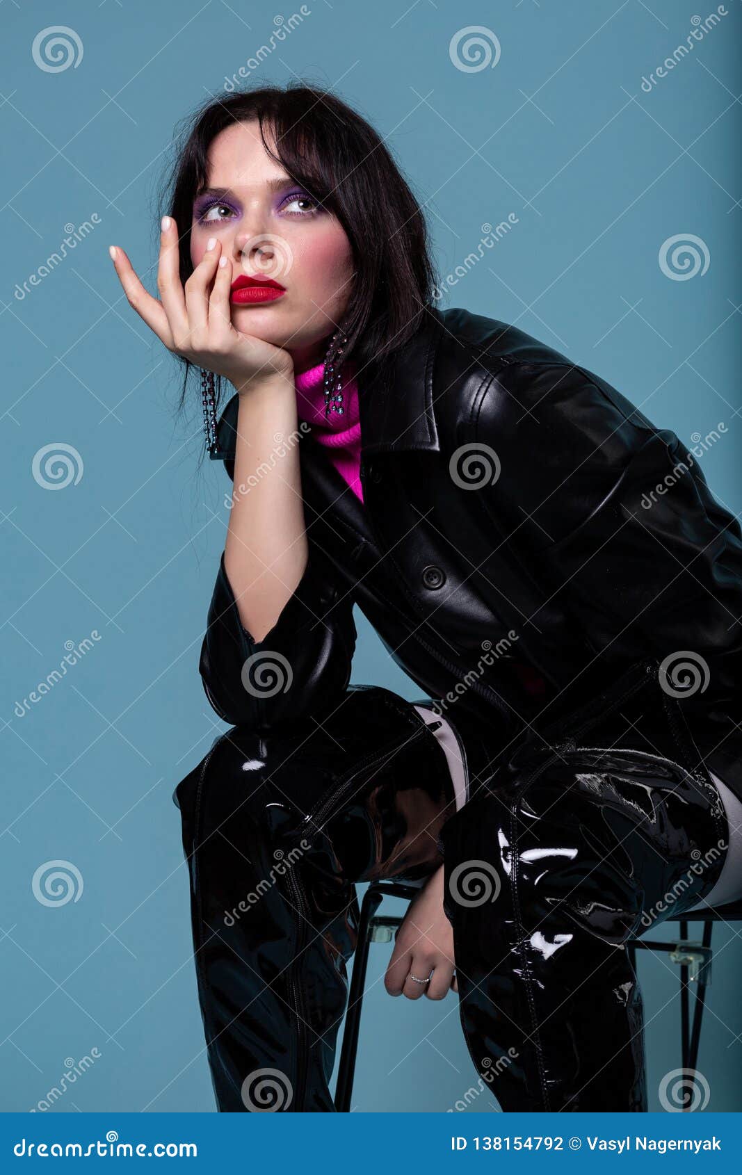 Dreaming Woman with Colorful Makeup Sitting on a Chair, Looking ...